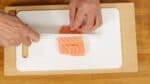 Cut the sashimi-grade Atlantic salmon into one and 1.5cm (0.6") cubes.