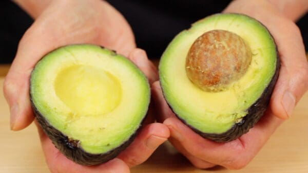 Twist the avocado and divide the two halves.