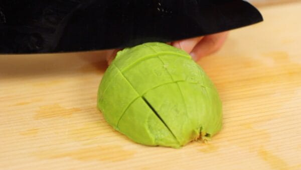 Then, cut the avocado into 1.5cm (0.6") cubes.