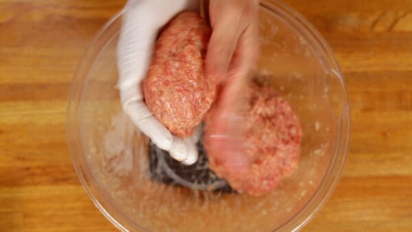 Then, shape the meat mixture into an oval with your hands.