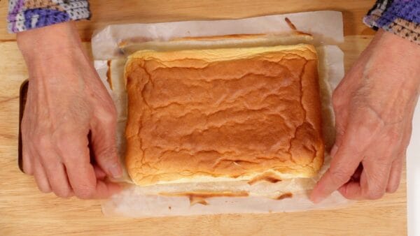 When the cake is cool, peel off the parchment paper from the sides. It is moist and fluffy and looks delicious.