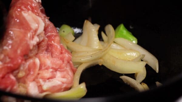 Add the pork slices. This is pork thigh for a shabu shabu hotpot but you can also use pork belly.