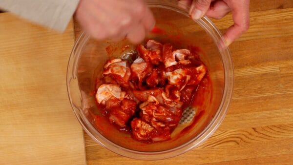Toss the chicken to coat with the marinade.