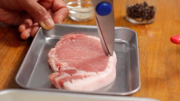 This will prevent the meat from curling and help to cook evenly.