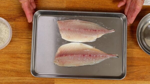 First, let's prepare the aji, Japanese horse mackerel. This horse mackerel was filleted into three pieces at the fish market this morning. Since there are still some rib bones remaining, we will remove them.