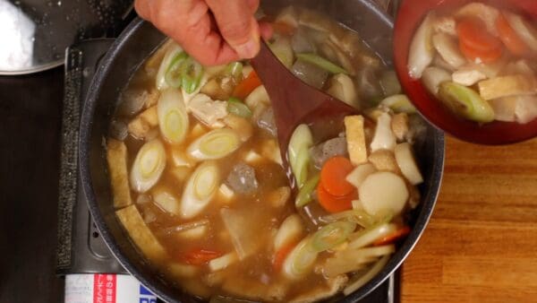 Ladle the kenchin-jiru into a bowl.
