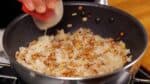 Dissolve the granulated chicken stock powder in the sake. Then pour the chicken stock over the rice.