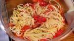 Now, add the remaining seasonings and ingredients to the cold pasta. Add the fragrant olive oil and sprinkle on black pepper.
