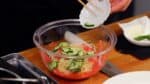 Add the grated garlic and thinly sliced cucumber.