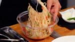 Mix all the ingredients with the pasta using kitchen tongs. It’s a pasta symphony!